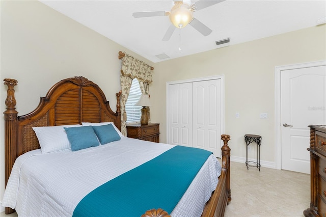 bedroom with light tile patterned flooring, ceiling fan, and a closet