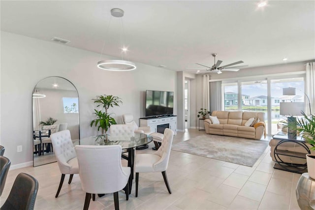 dining space featuring ceiling fan