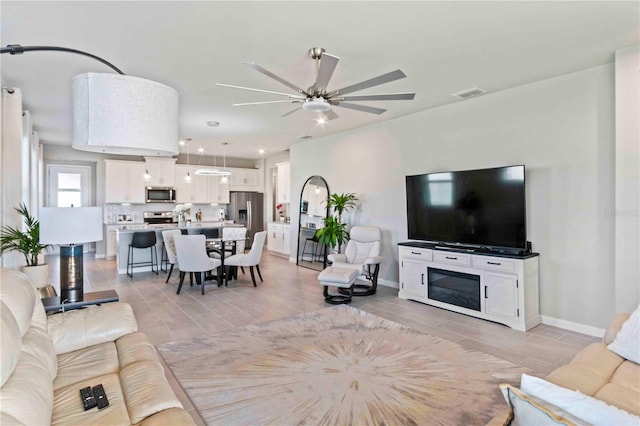 living room with ceiling fan