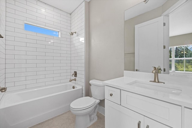 full bathroom with vanity, toilet, and tiled shower / bath