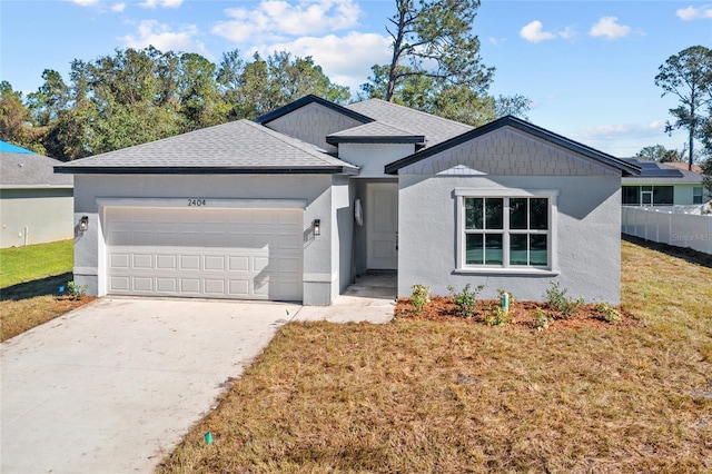 single story home with a front lawn and a garage