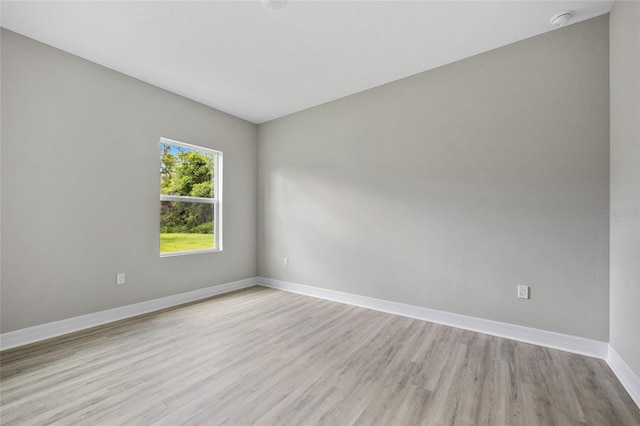 2404 Hanford Ln, North Port, FL 34288 - spare room featuring baseboards and light wood-style floors