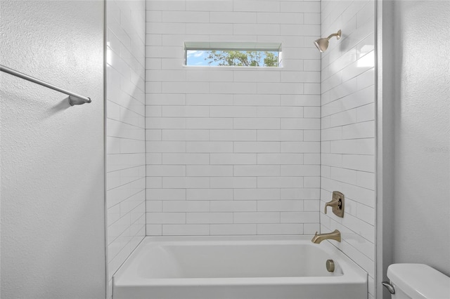 2404 Hanford Ln, North Port, FL 34288 - full bath featuring toilet, a textured wall, and shower / washtub combination