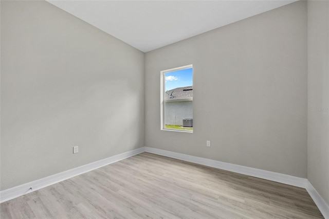 2404 Hanford Ln, North Port, FL 34288 - unfurnished room with baseboards and light wood-style floors