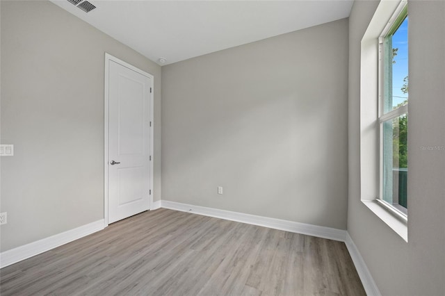 2404 Hanford Ln, North Port, FL 34288 - spare room with baseboards, wood finished floors, and visible vents