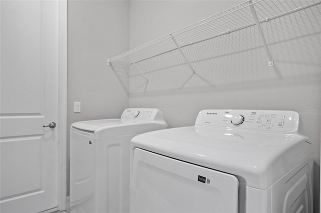 2404 Hanford Ln, North Port, FL 34288 - washroom with separate washer and dryer and laundry area