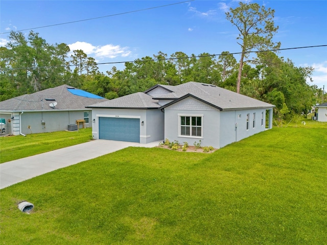 2404 Hanford Ln, North Port, FL 34288 - single story home with concrete driveway, an attached garage, stucco siding, and a front lawn