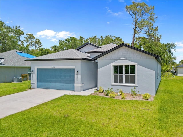 2404 Hanford Ln, North Port, FL 34288 - view of front of property with central air condition unit, driveway, a front yard, and a garage