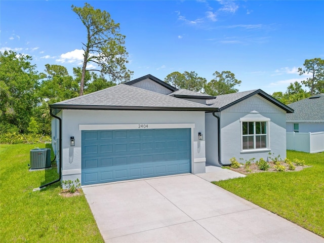 2404 Hanford Ln, North Port, FL 34288 - ranch-style home with central air condition unit, an attached garage, driveway, and a front yard
