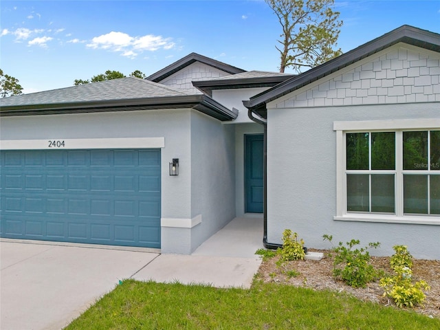 2404 Hanford Ln, North Port, FL 34288 - ranch-style home with a garage, stucco siding, concrete driveway, and roof with shingles