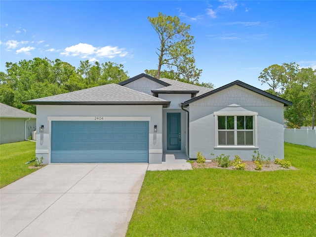 2404 Hanford Ln, North Port, FL 34288 - view of front facade with a garage, a front lawn, stucco siding, and concrete driveway