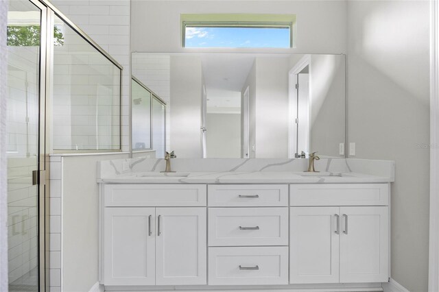 2404 Hanford Ln, North Port, FL 34288 - full bathroom with a sink, baseboards, a stall shower, and double vanity