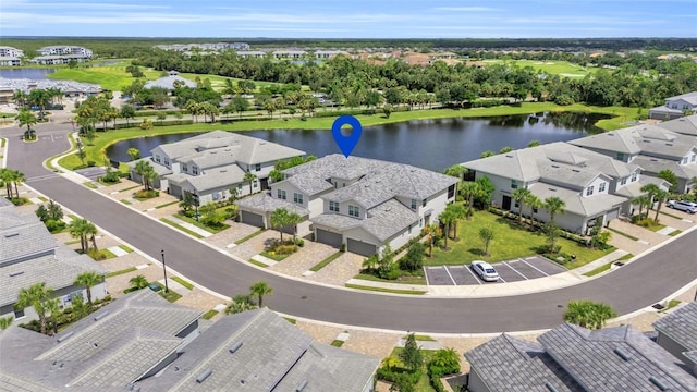 birds eye view of property featuring a water view