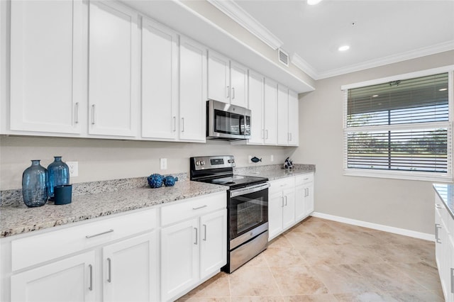 kitchen featuring light stone countertops, ornamental molding, white cabinets, and stainless steel appliances