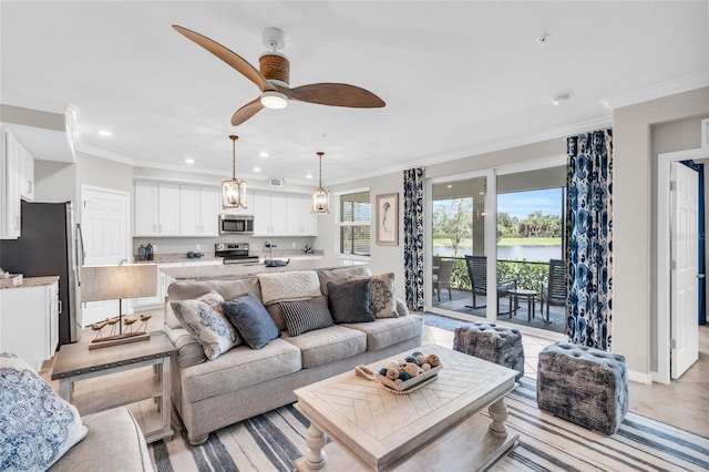 living room with ornamental molding and ceiling fan