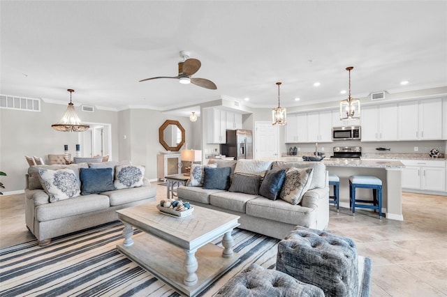 tiled living room featuring crown molding and ceiling fan with notable chandelier