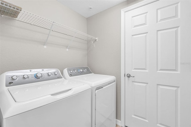 laundry room featuring independent washer and dryer