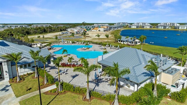 birds eye view of property featuring a water view