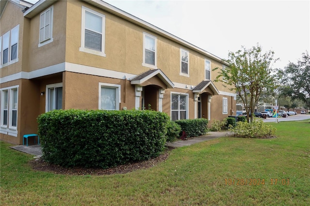 view of home's exterior featuring a lawn