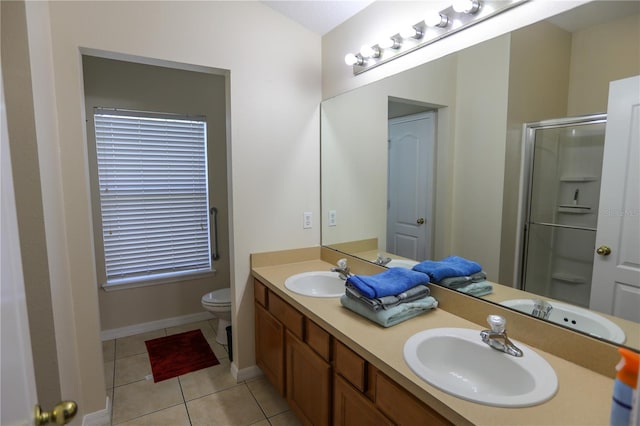 bathroom with toilet, an enclosed shower, vanity, and tile patterned floors