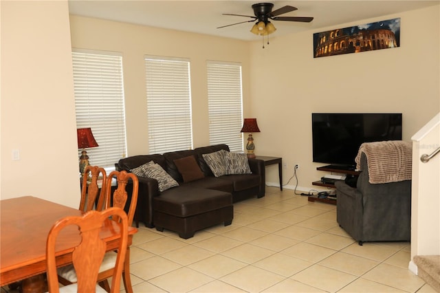 living room featuring ceiling fan and light tile patterned floors