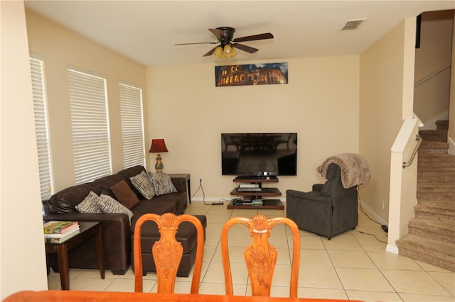 tiled living room featuring ceiling fan