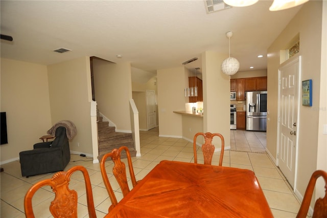 dining area with light tile patterned floors