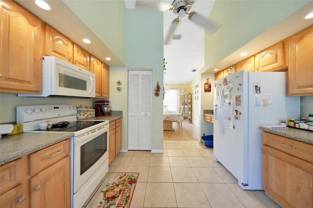 kitchen featuring ceiling fan, light tile patterned flooring, and white appliances