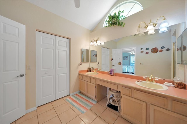 bathroom featuring vanity, vaulted ceiling, tile patterned floors, and ceiling fan