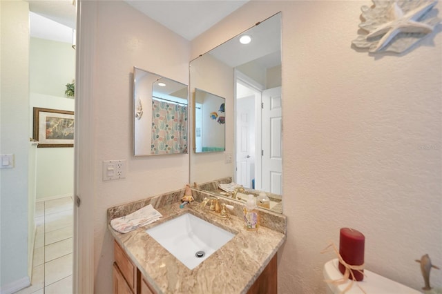 bathroom featuring tile patterned floors and vanity