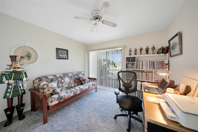 carpeted office space with ceiling fan