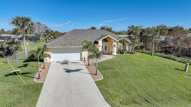 ranch-style house featuring a garage and a front lawn