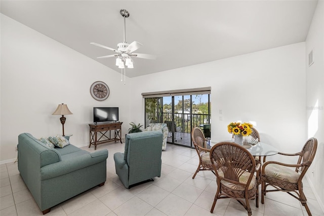 tiled living room with ceiling fan and lofted ceiling