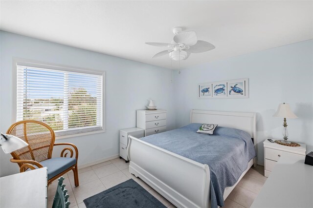 tiled bedroom with ceiling fan