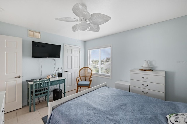 tiled bedroom with ceiling fan