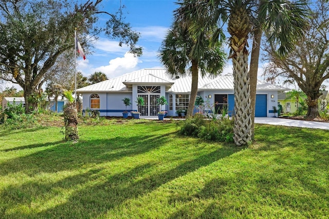 ranch-style home featuring a front yard and a garage