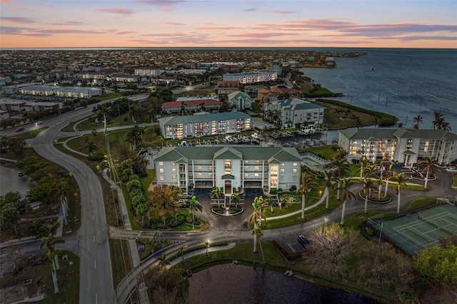 aerial view at dusk with a water view