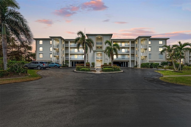 view of outdoor building at dusk