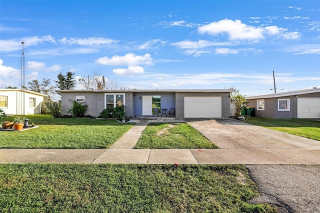 ranch-style house featuring a front yard and a garage