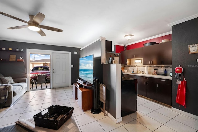 kitchen with ornamental molding, sink, tasteful backsplash, light tile patterned floors, and ceiling fan