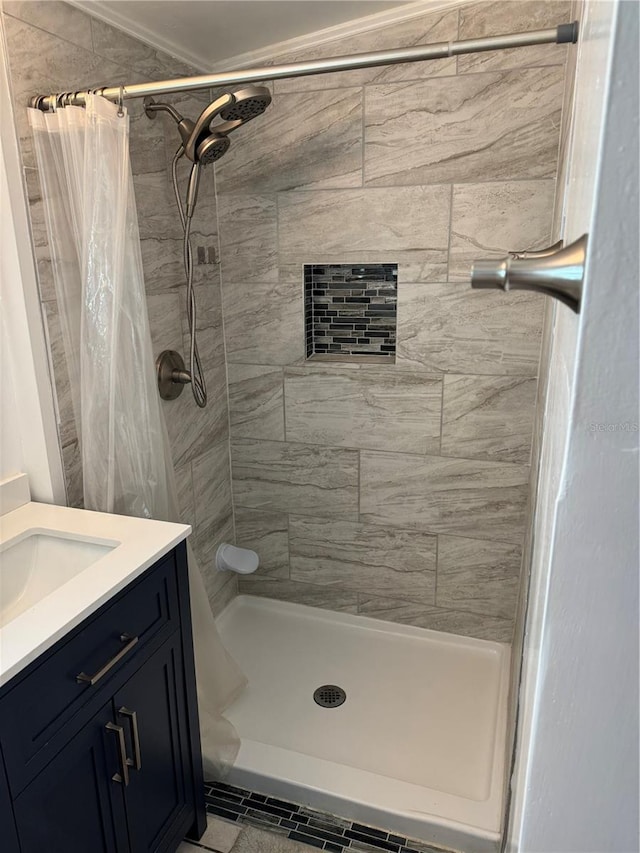 bathroom featuring vanity and curtained shower