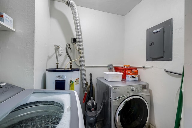 washroom featuring electric panel and washer and clothes dryer