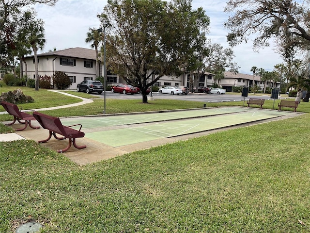 view of community with a lawn