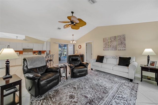 living room featuring lofted ceiling, ceiling fan with notable chandelier, and light tile patterned floors