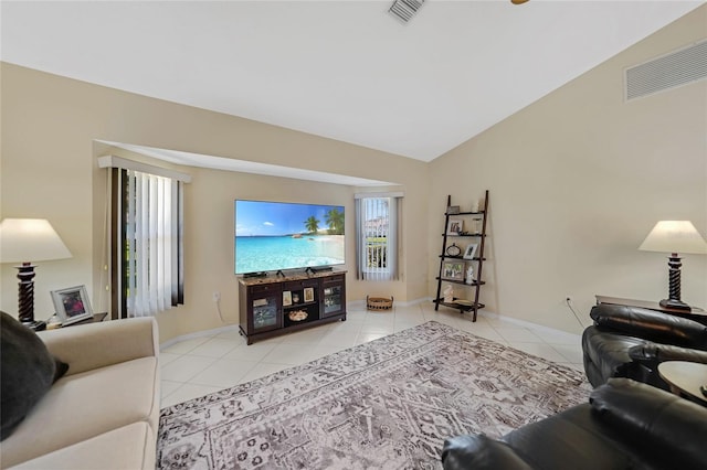 tiled living room featuring lofted ceiling