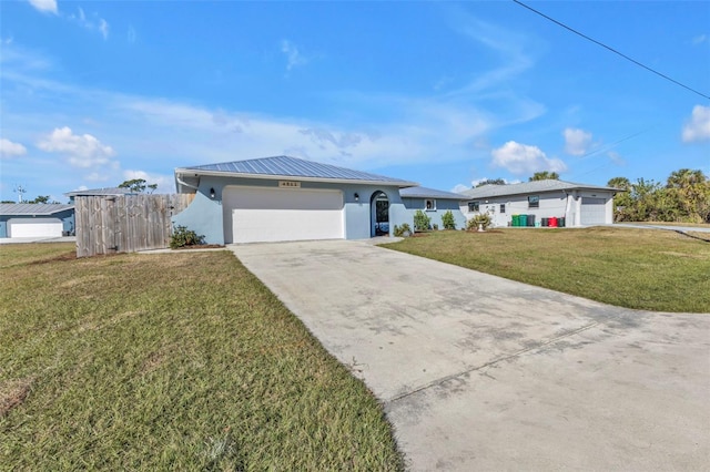 ranch-style house featuring stucco siding, a front lawn, concrete driveway, an attached garage, and metal roof