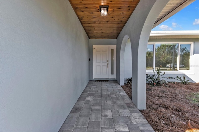 doorway to property with stucco siding