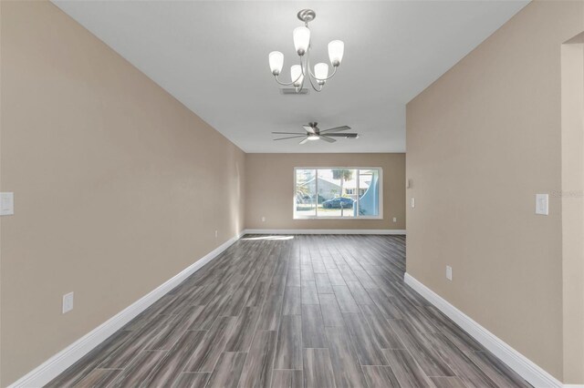 unfurnished room with baseboards, dark wood-type flooring, and ceiling fan