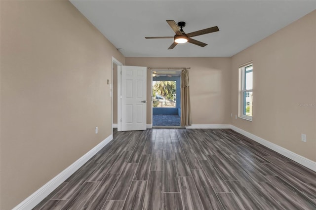 spare room with wood finish floors, baseboards, and ceiling fan