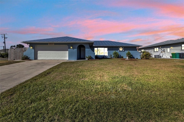 ranch-style house with a front yard, cooling unit, a standing seam roof, stucco siding, and metal roof